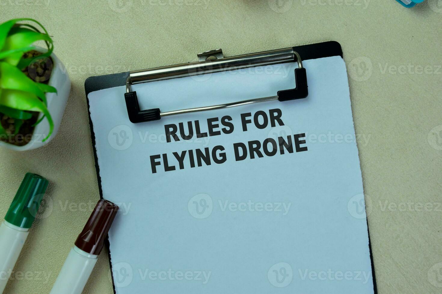 Concept of Rules For Flying Drone write on paperwork isolated on Wooden Table. photo