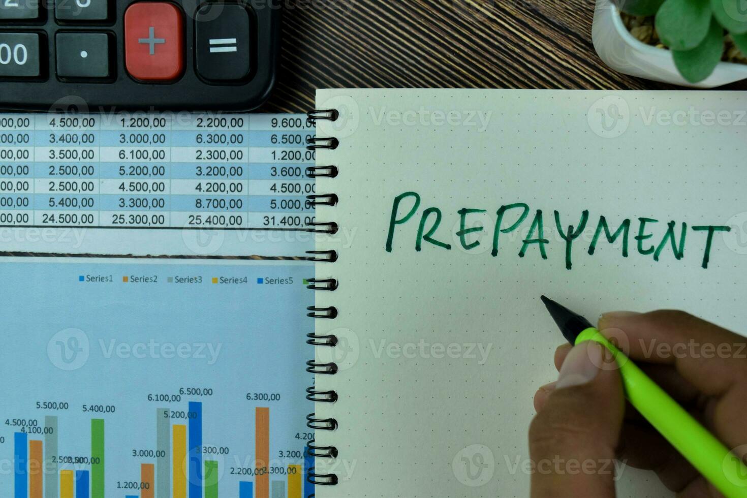 Concept of Prepayment write on a book isolated on Wooden Table. photo