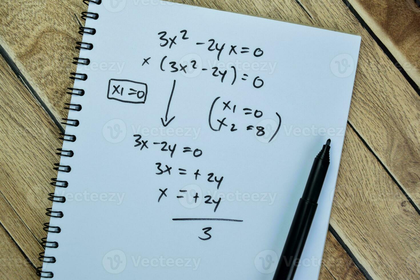 Concept of math formulas write on book isolated on Wooden Table. photo