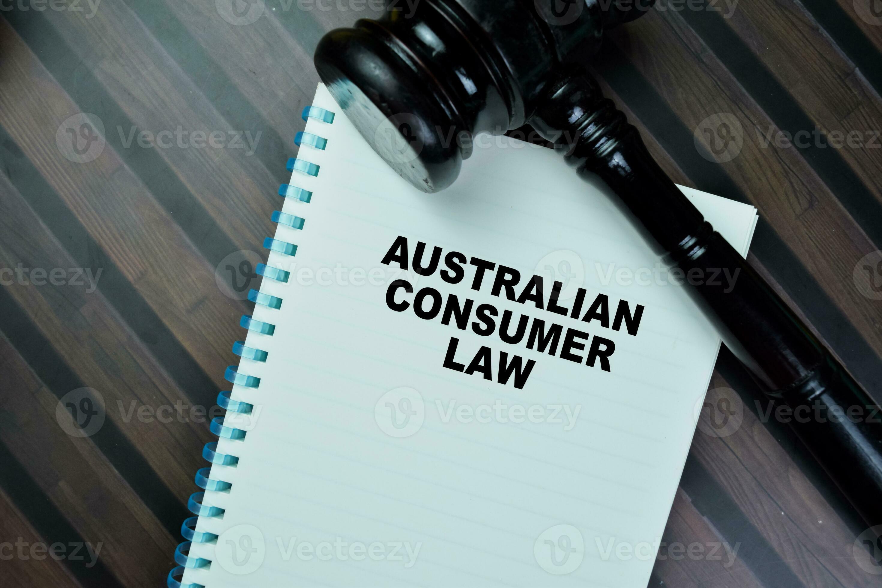 Concept of Australian Consumer Law write on book with gavel isolated on Wooden Table. 24688812