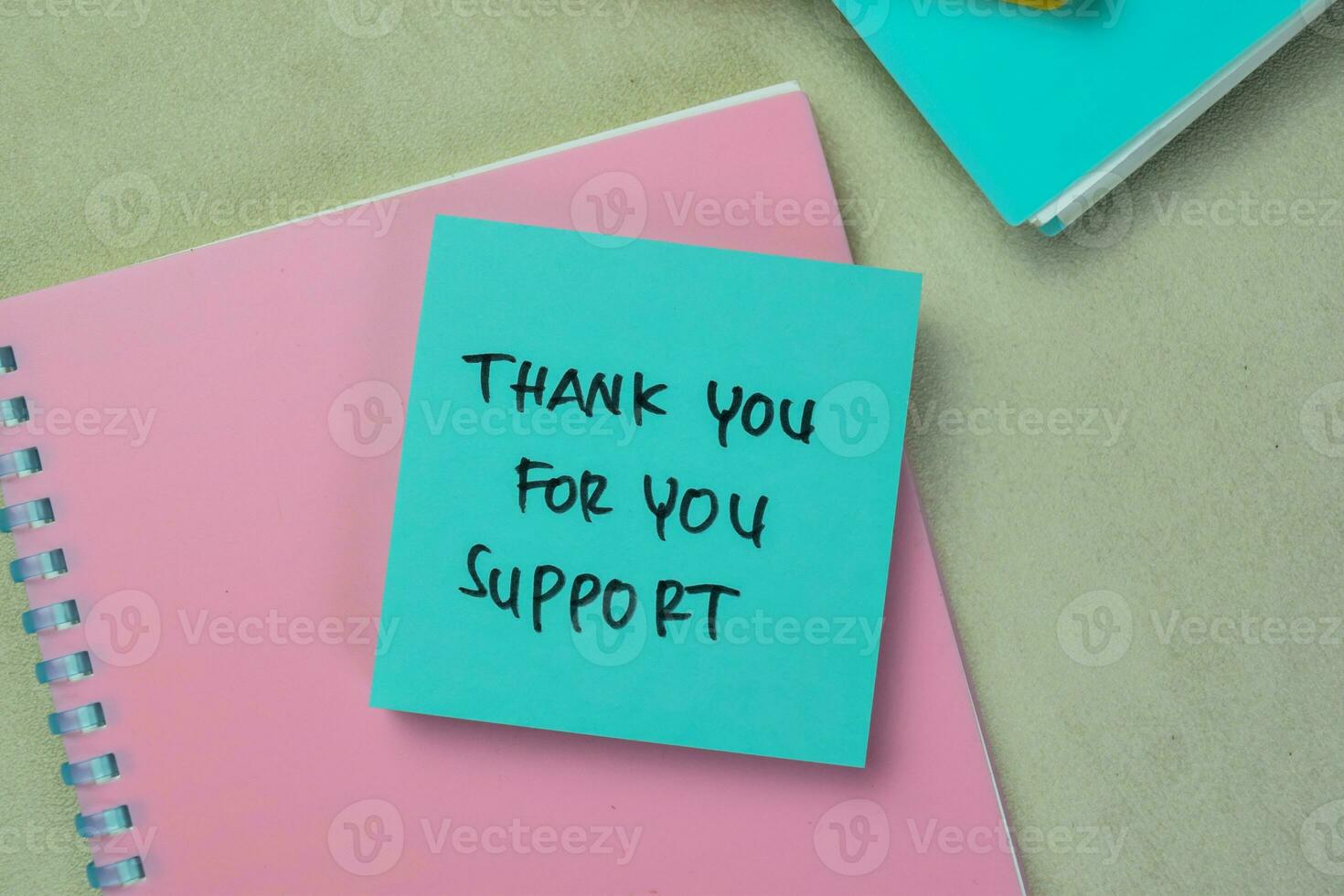 Concept of Thank You For You Support write on sticky notes isolated on Wooden Table. photo