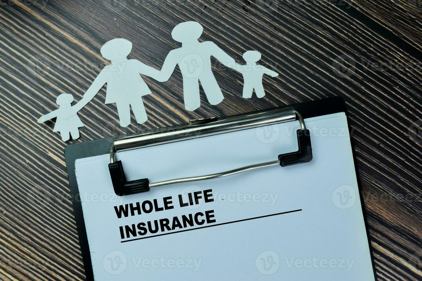 Concept of Whole Life Insurance write on paperwork isolated on Wooden Table. photo