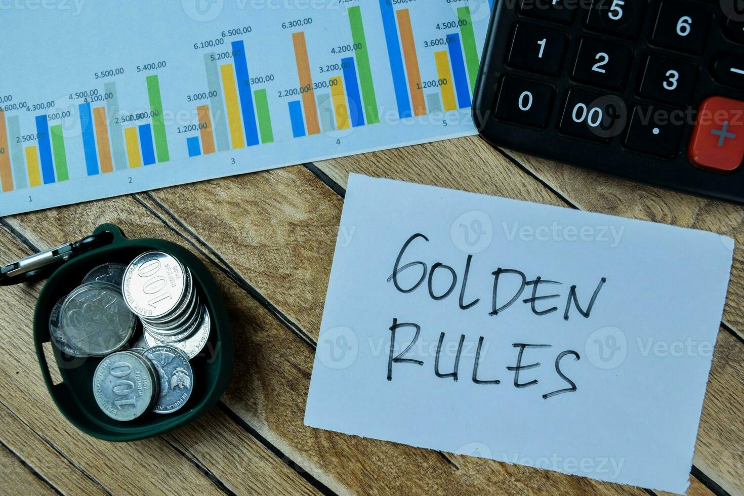 Concept of Golden Rules write on paperwork isolated on Wooden Table. photo