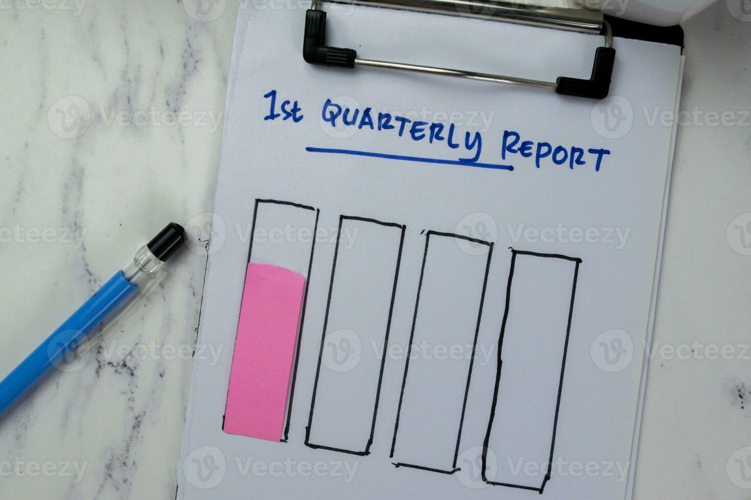 Concept of 1st Quarterly Report write on paperwork and bar graph isolated on Wooden Table. photo