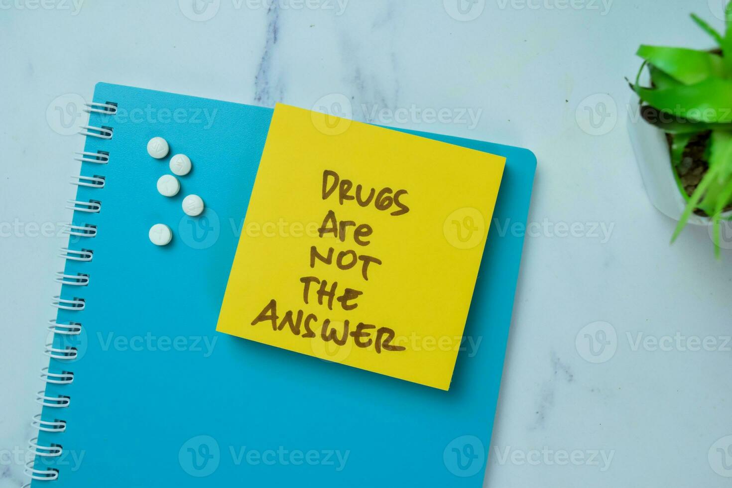 Concept of Drugs Are Not The Answer write on sticky notes isolated on Wooden Table. photo