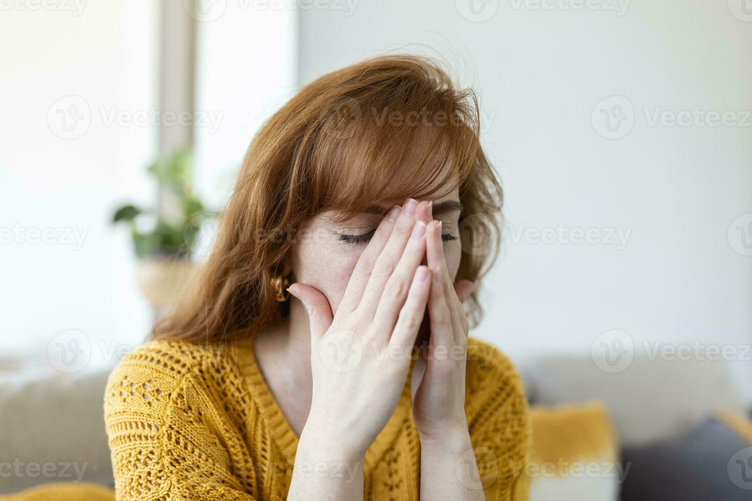 Sad woman feels miserable desperate sit on sofa look out the window thinking about personal troubles does not see way out of difficult life situation. Break up, heartbreak, cheated girl concept photo