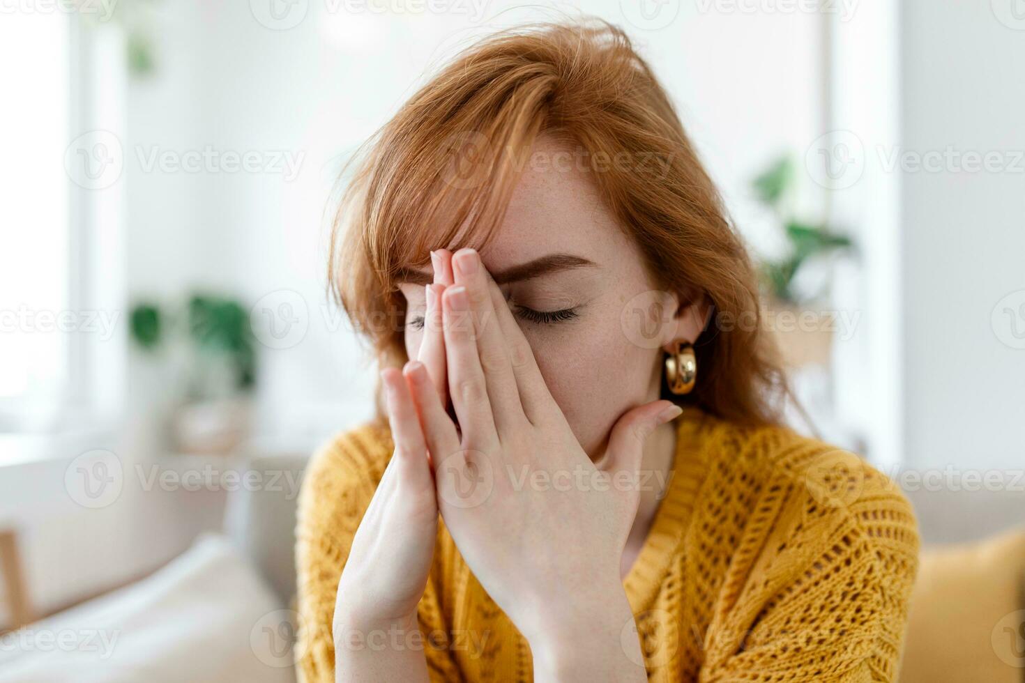 Sad woman feels miserable desperate sit on sofa look out the window thinking about personal troubles does not see way out of difficult life situation. Break up, heartbreak, cheated girl concept photo