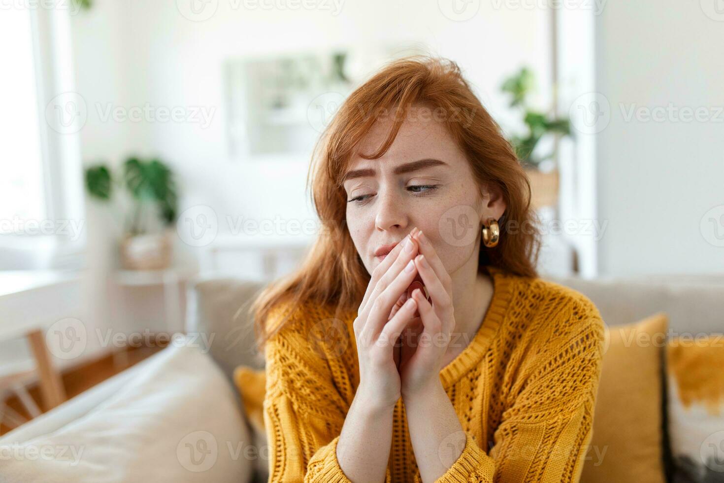 Sad woman feels miserable desperate sit on sofa look out the window thinking about personal troubles does not see way out of difficult life situation. Break up, heartbreak, cheated girl concept photo