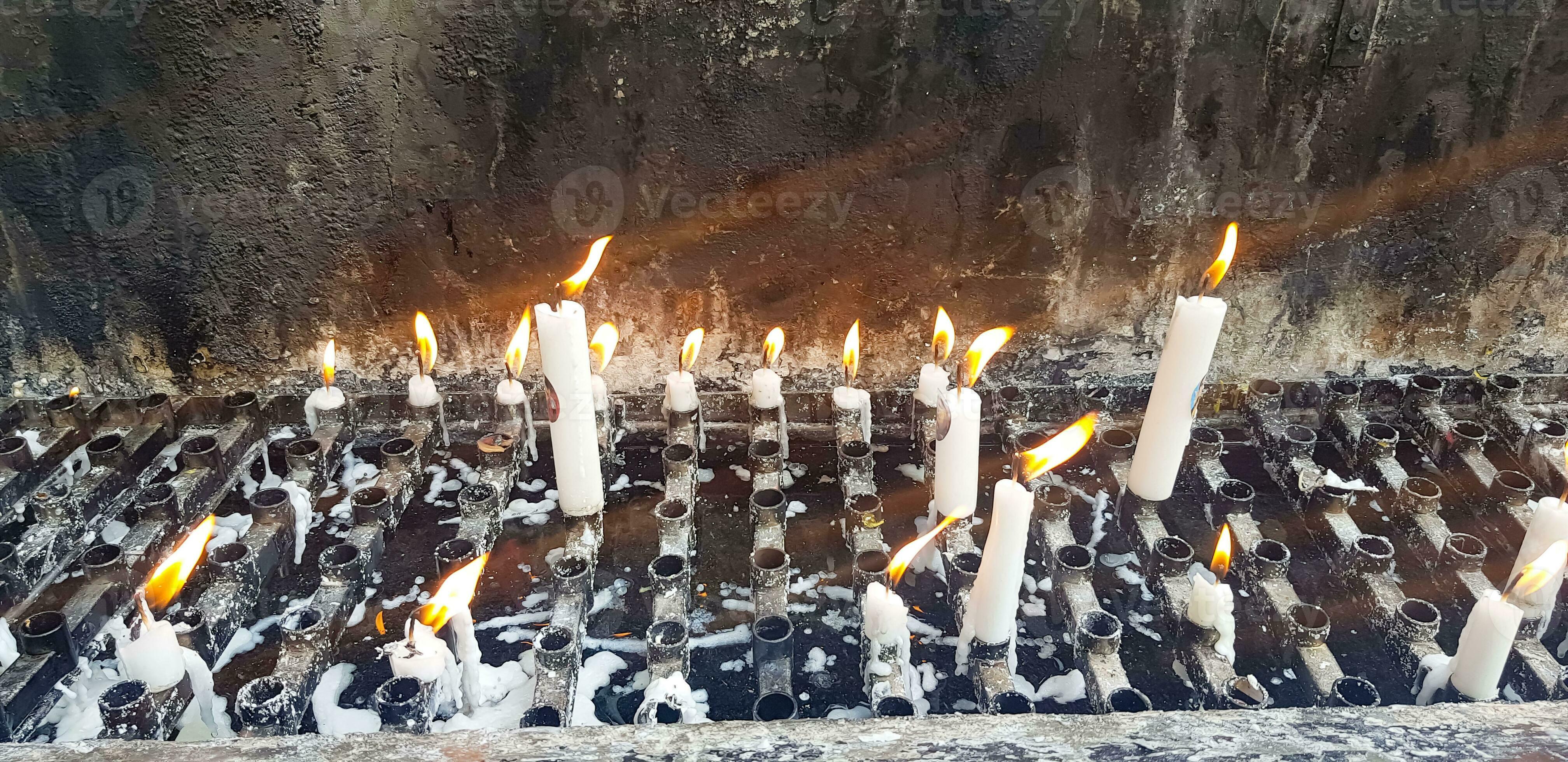 Prayers candle in one quite praying place, each candle represents the