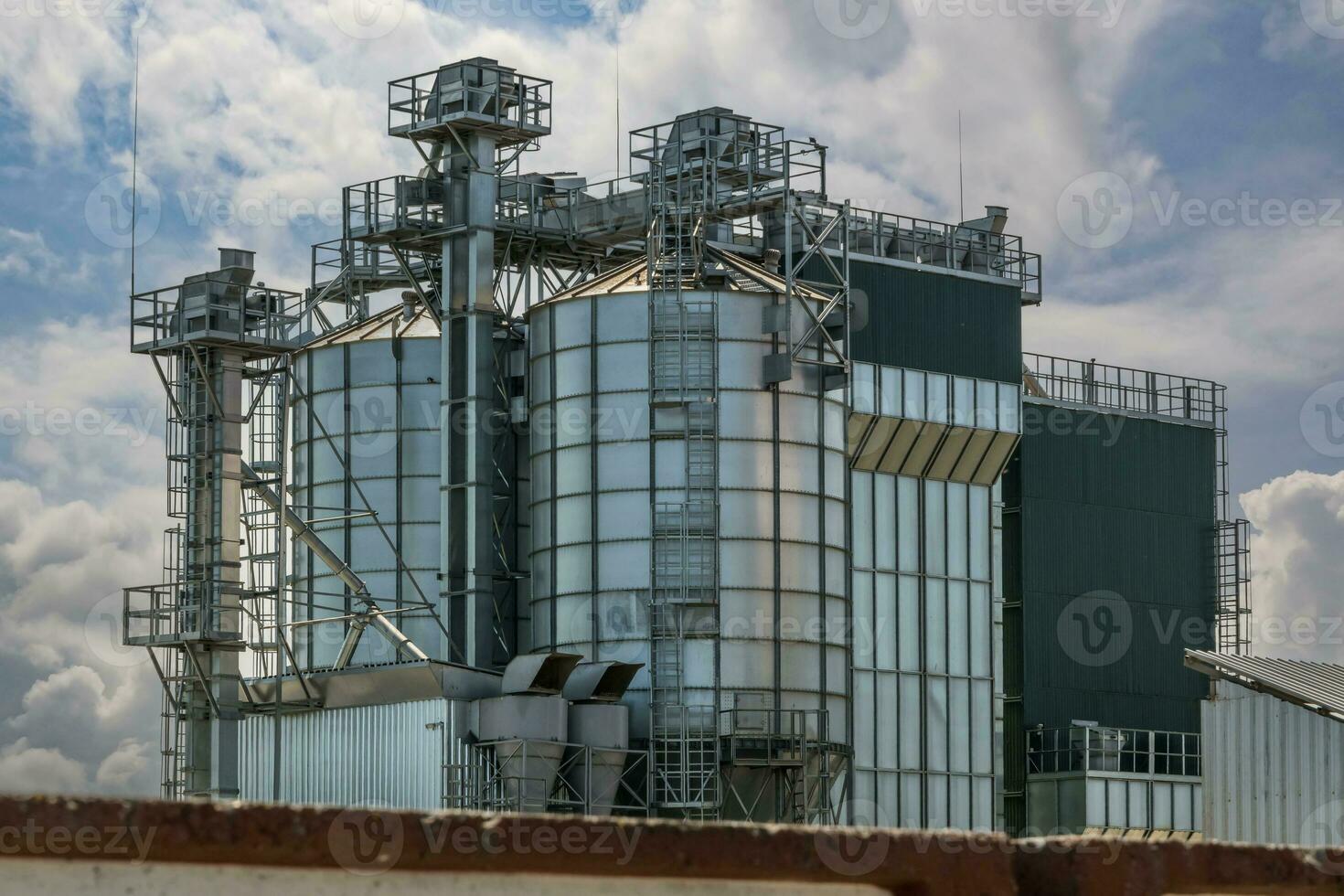 agro silos on agro-industrial complex and grain drying and seeds cleaning line. photo