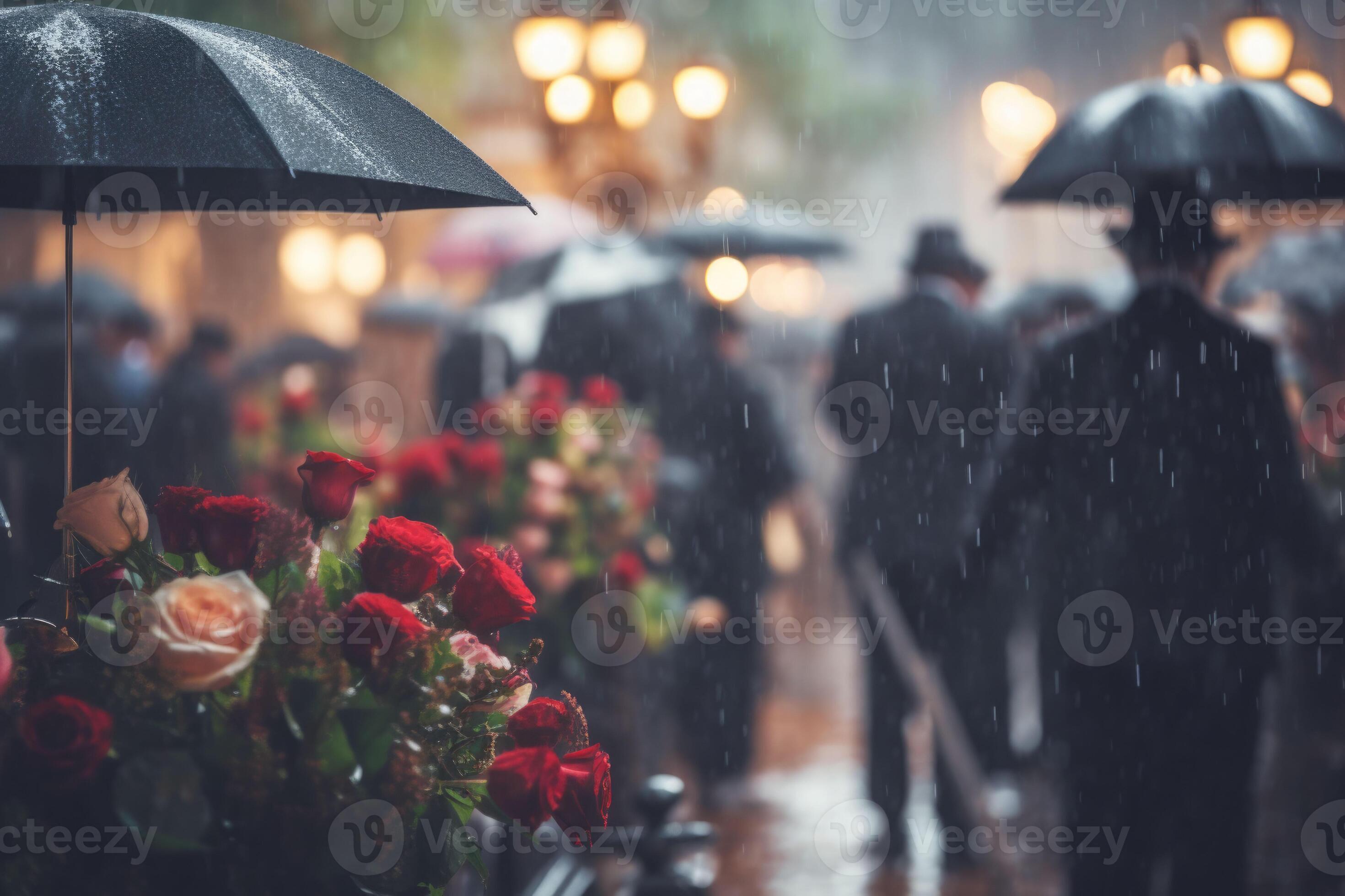 Rainy funeral. Cemetery on a rainy day with flowers and blurred