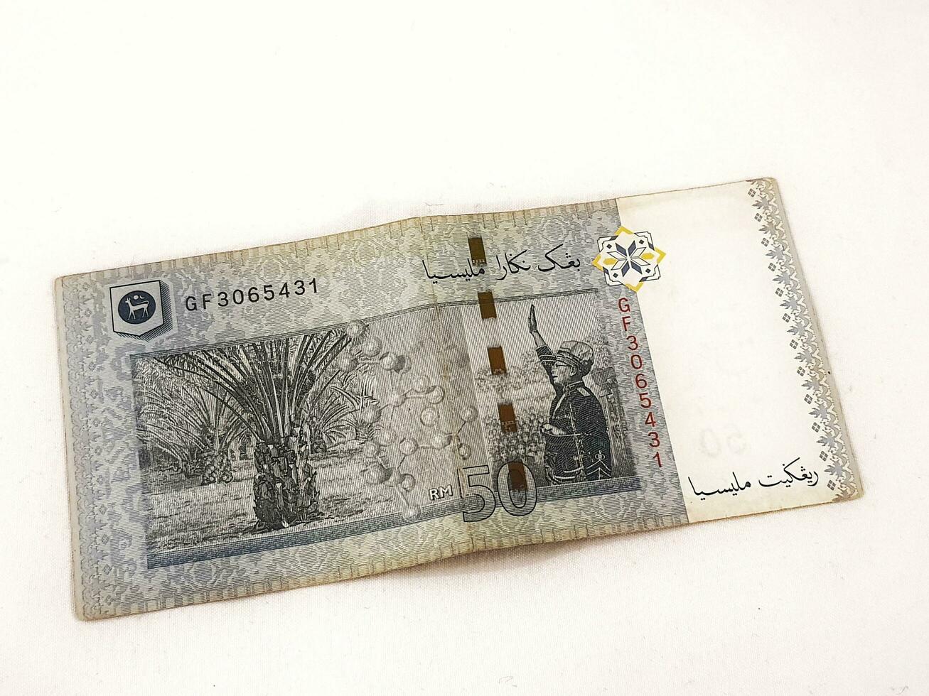 Isolated white photo of one ringgit malaysian bank notes.