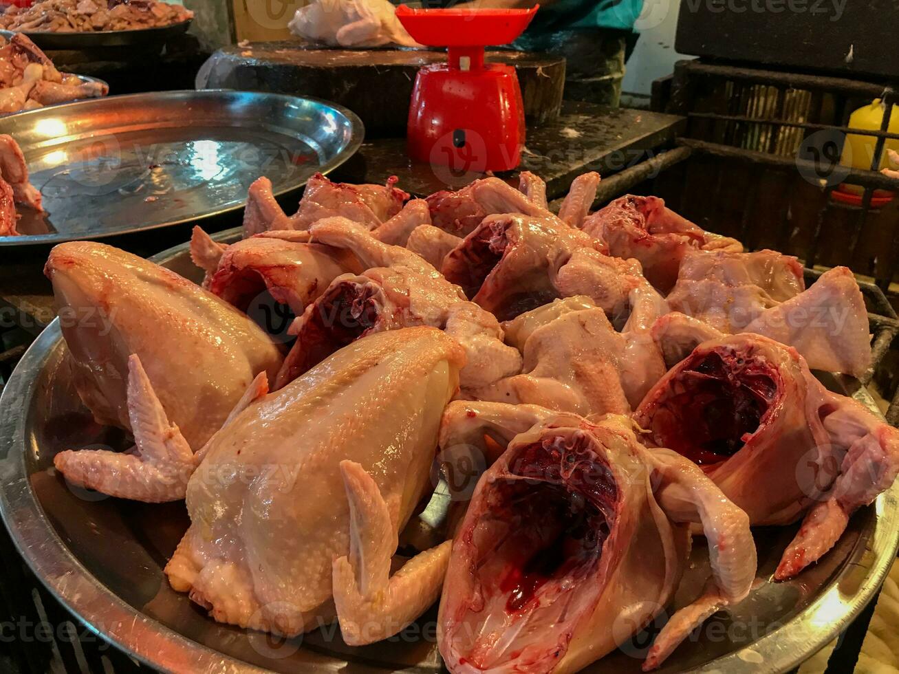 Raw chicken meat in the butcher shop. Broiler seller in traditional market. Selective focus photo
