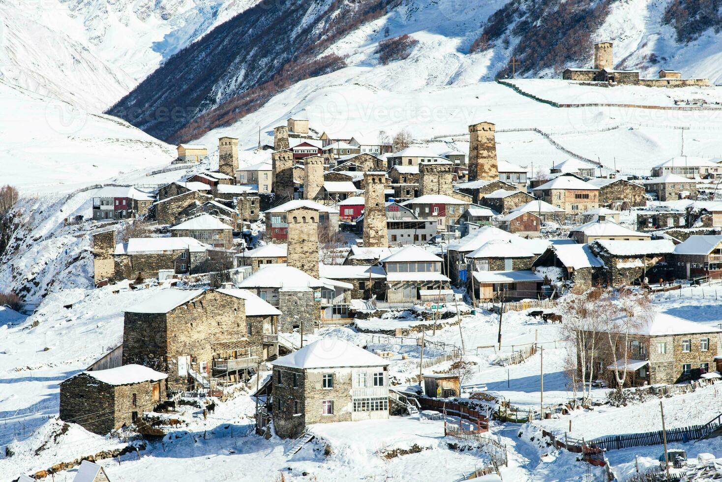 Small village in winter with Caucasus mountain. Ushguli famous landmark in Svaneti Georgia is one of the highest settlements in Europe. photo