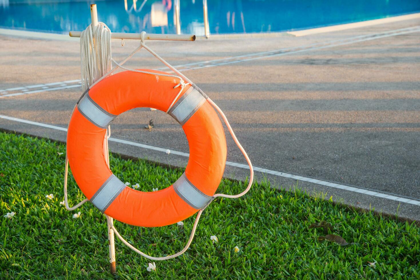 Red Lifebuoy near the swimming pool photo