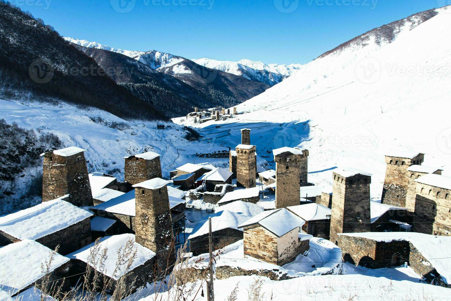 Small village in winter with Caucasus mountain. Ushguli famous landmark in Svaneti Georgia is one of the highest settlements in Europe. photo