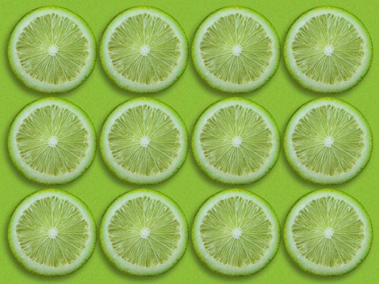 Lemon fruits slice seamless pattern with green background image photo