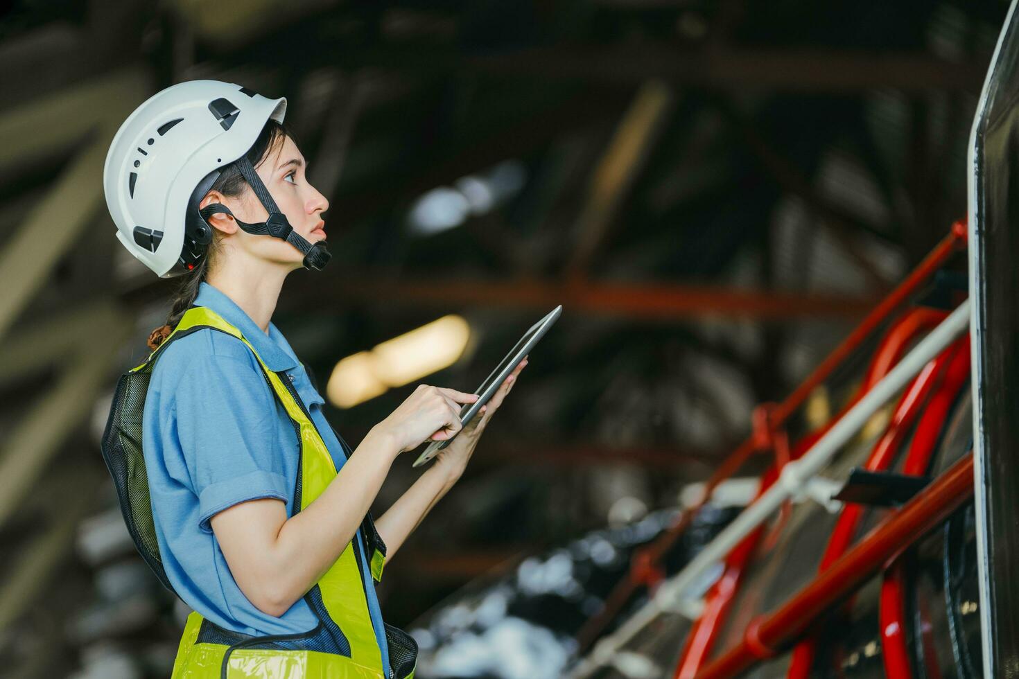 Women in factory engineer working using tablet computer photo