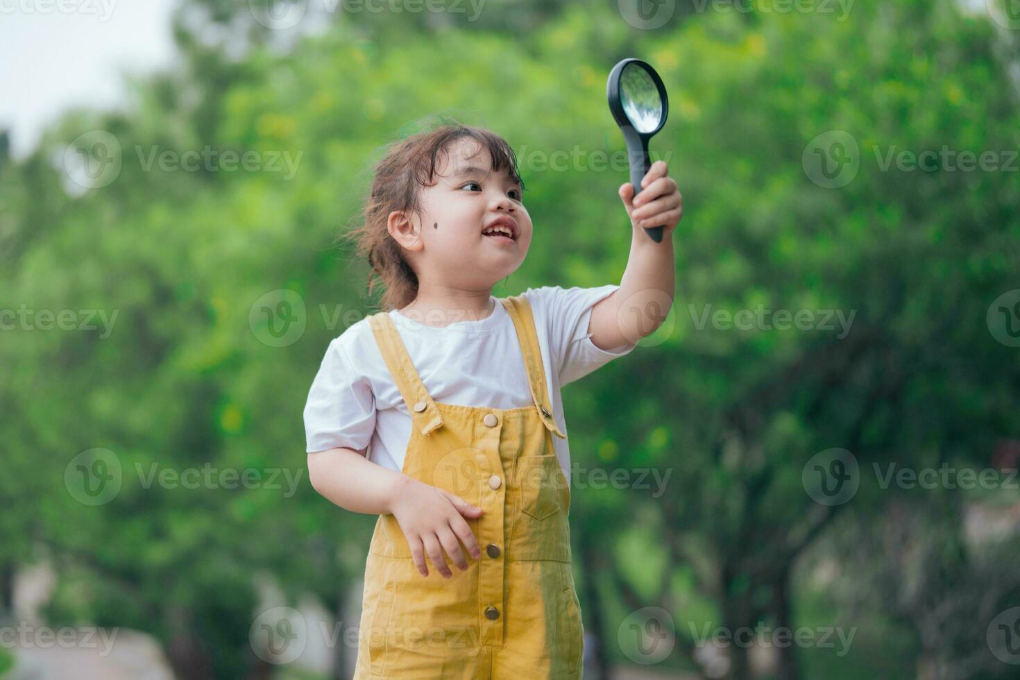Photo of young Asian baby girl playing at park