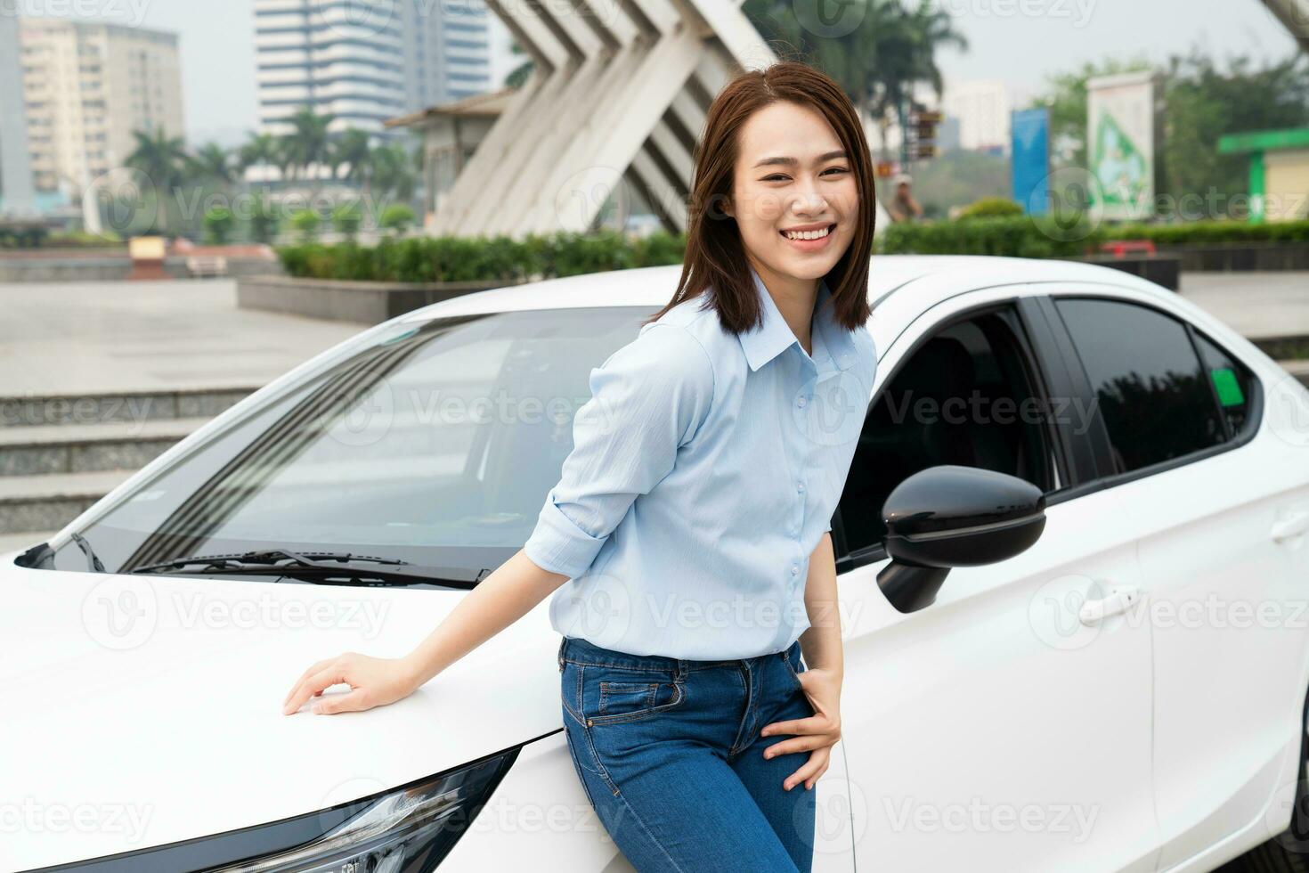 Young Asian woman with car photo