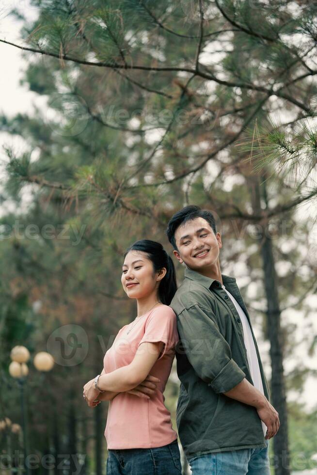 Portrait of young Asian couple outside photo