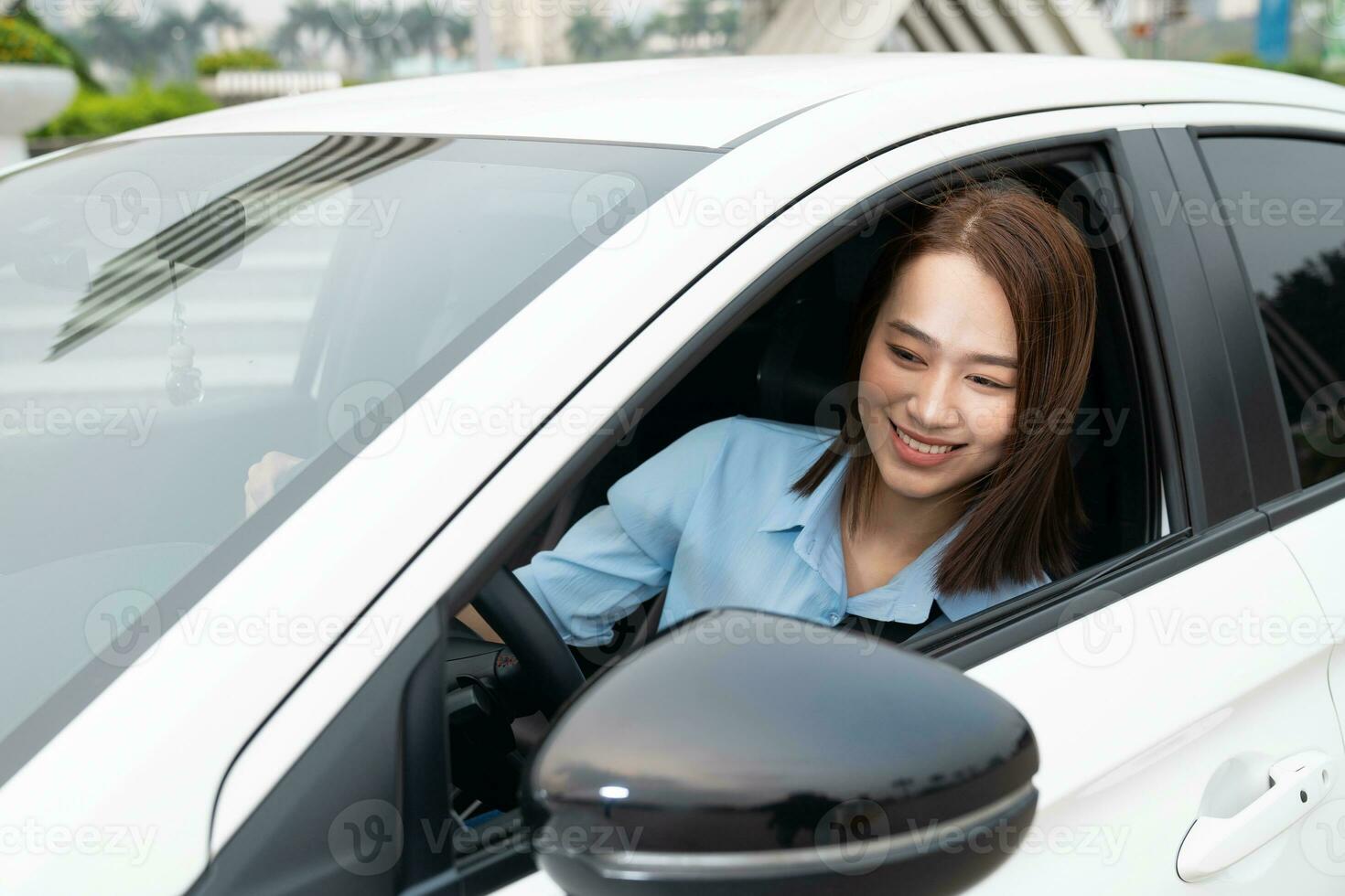 Young Asian woman with car photo