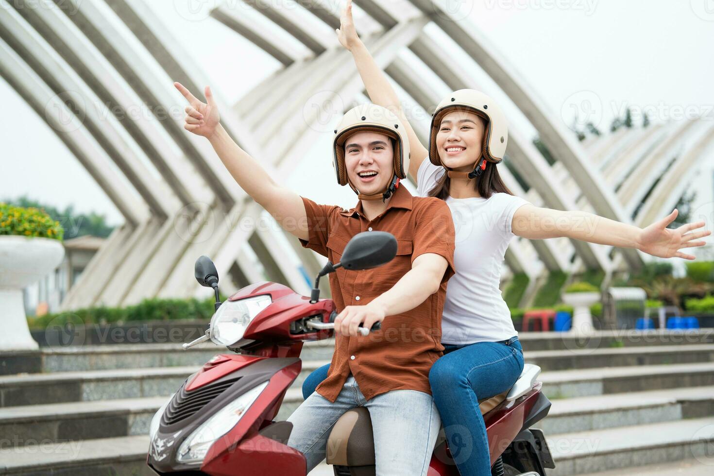 Young Asian couple on the motorbike photo
