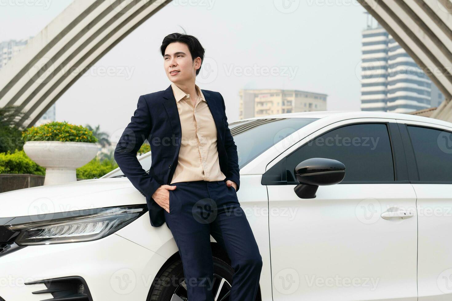 Young Asian business man with car photo