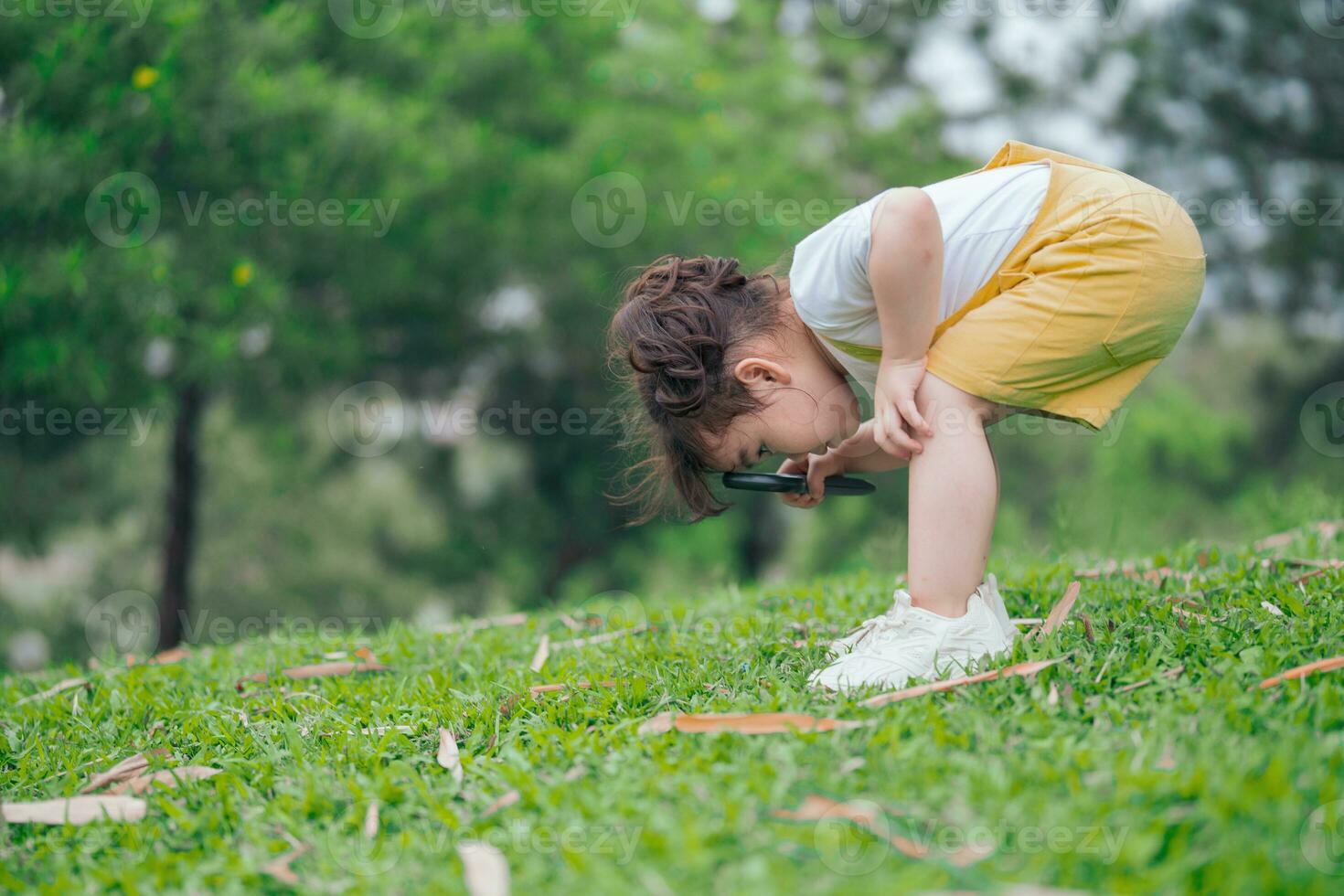 Photo of young Asian baby girl playing at park