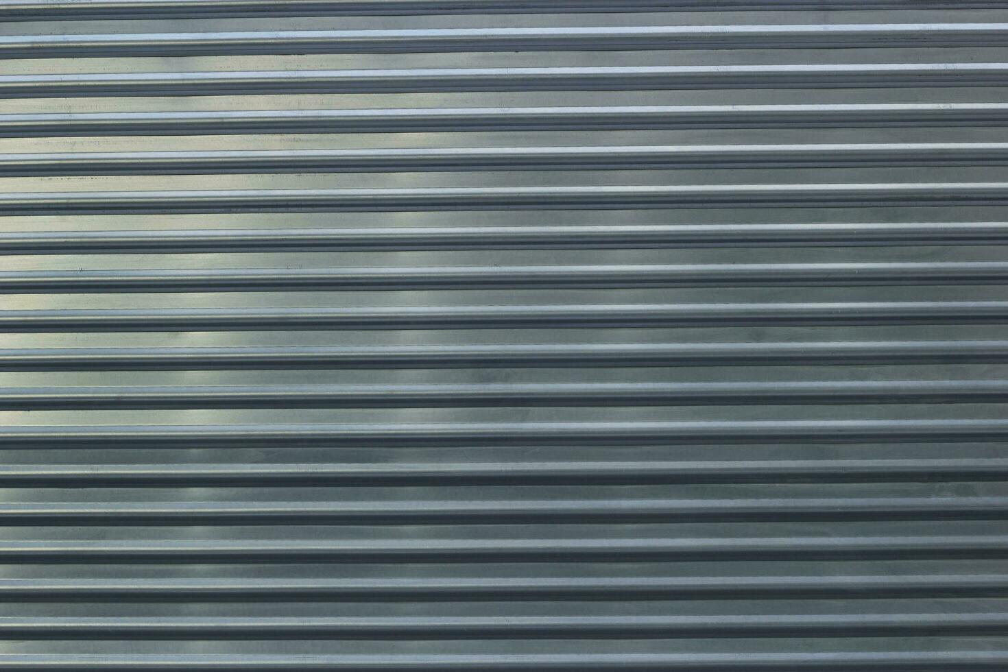 Photo of an abstract metal fence horizontal stripes.