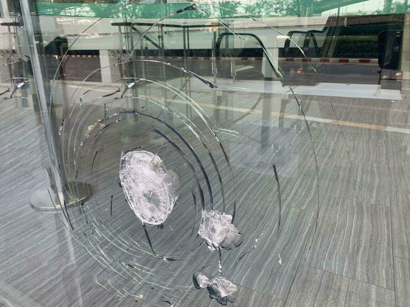 The glass was scratched from such a strong impact that it almost shattered, cracked glass photo