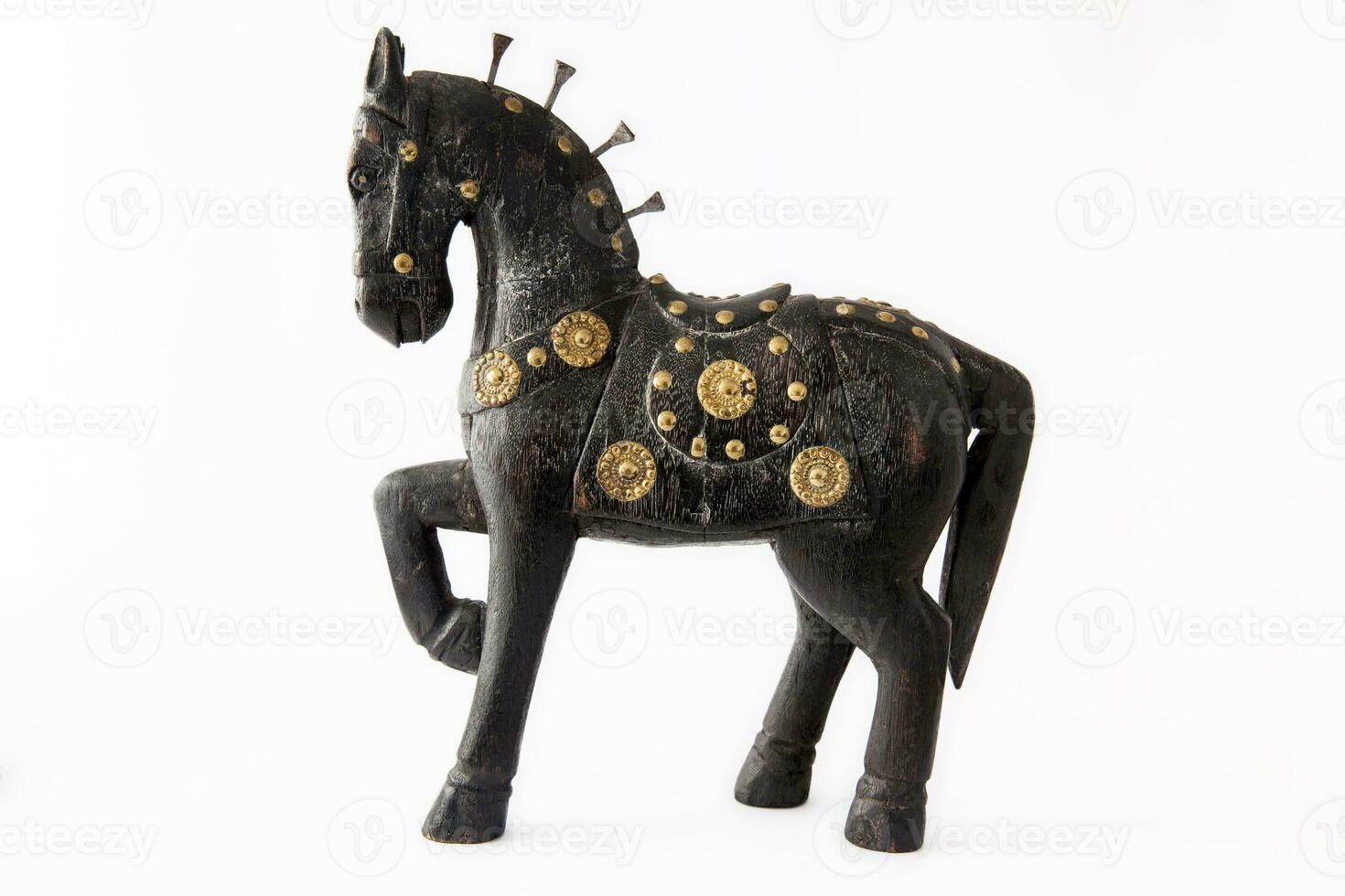 Dark wooden handcraft horse on white background photo