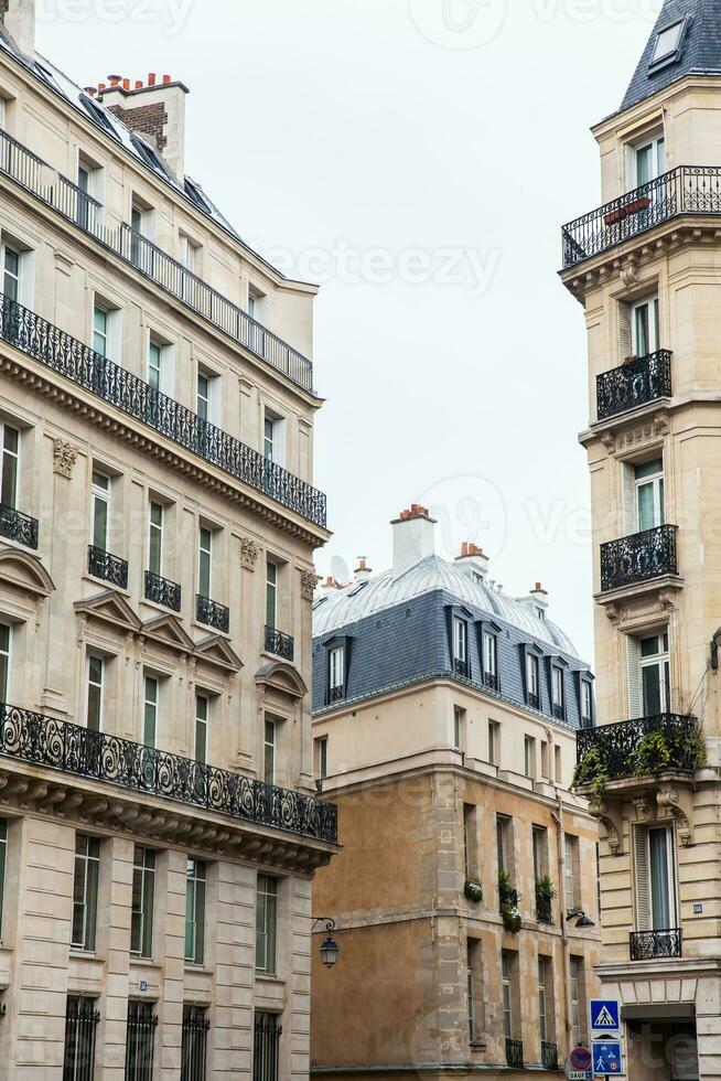Facade of the antique buildings at Danton street in Paris France photo