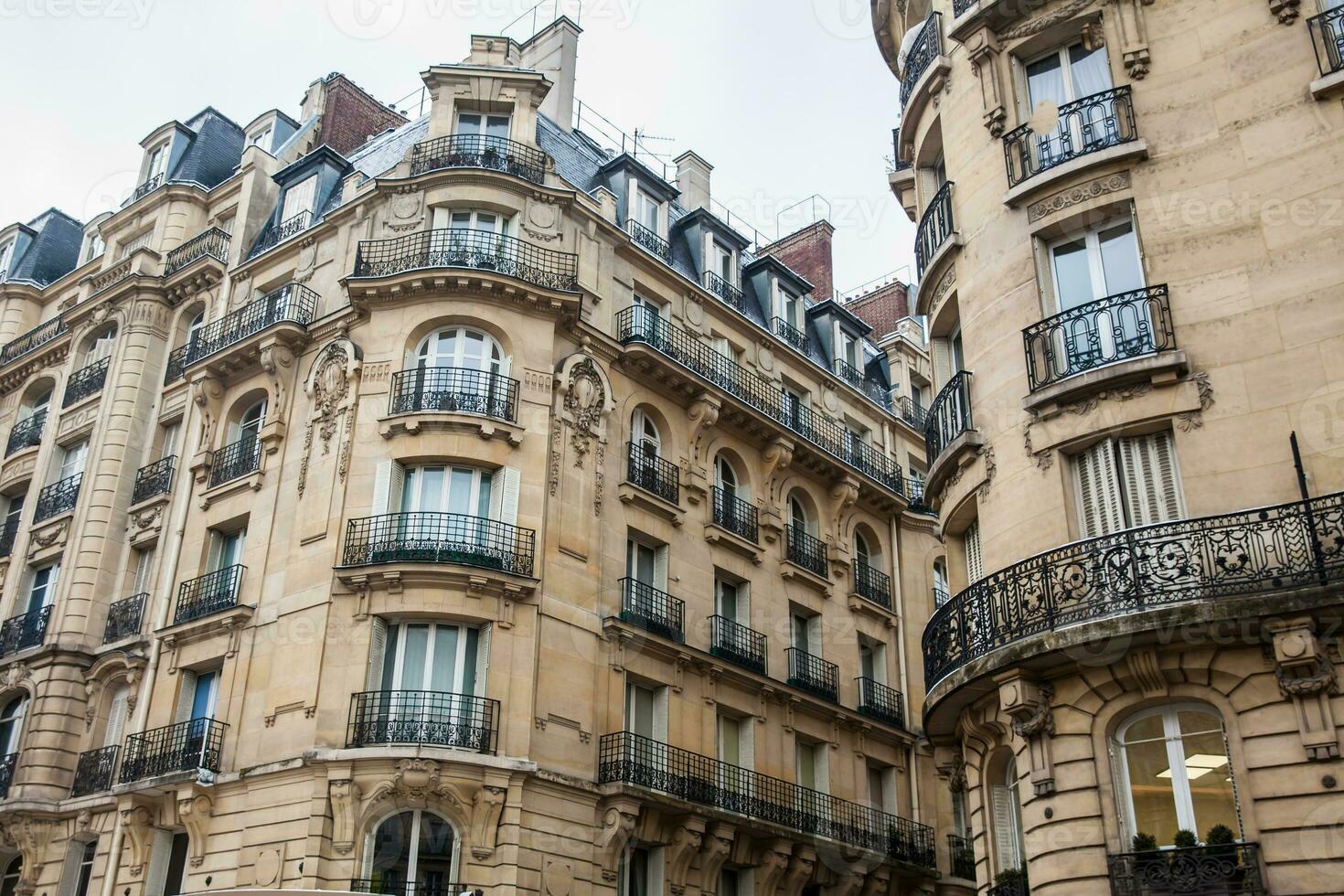 Facade of the antique buildings at Danton street in Paris France photo