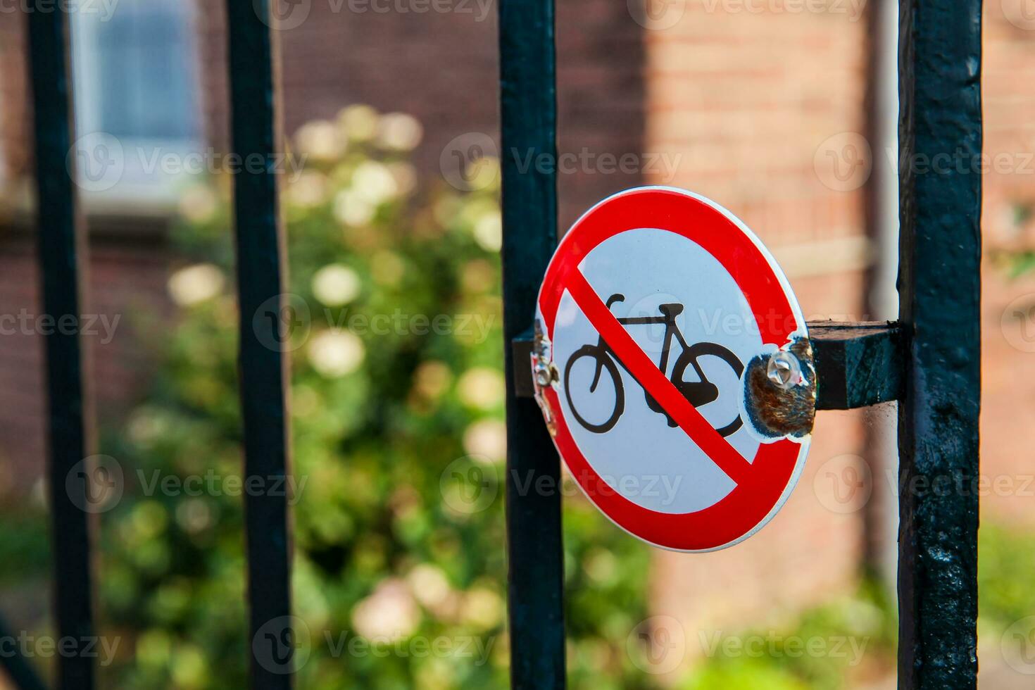 Do not lock bicycles here sign at a fence at the Museum Square in Amsterdam photo