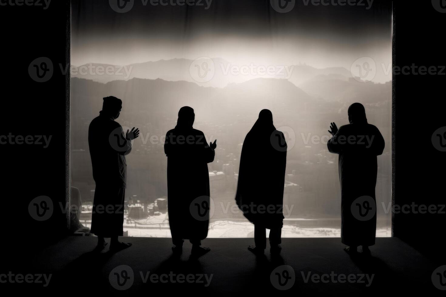 People standing in front of a large window with a cityscape view. photo