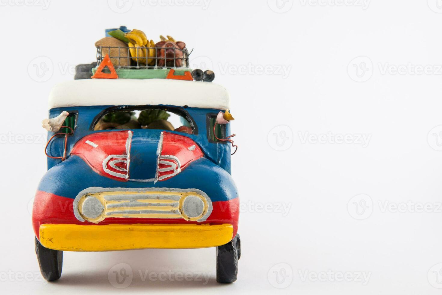 Colorful traditional rural bus from Colombia called chiva isolated on white background photo