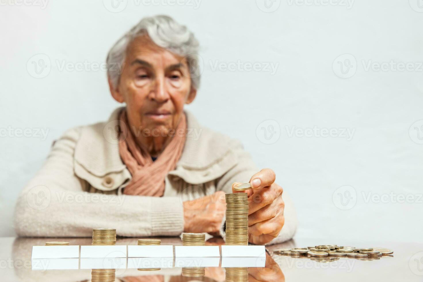 Senior woman saving money or budgeting photo