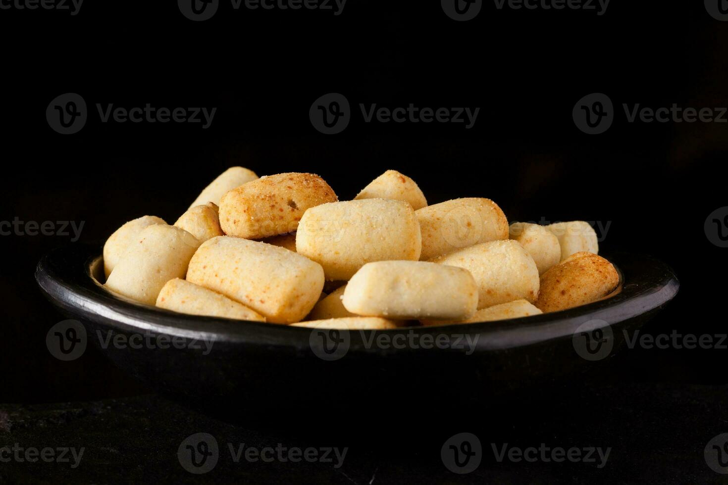 Traditional snack from Colombia called achira on black backgroun photo