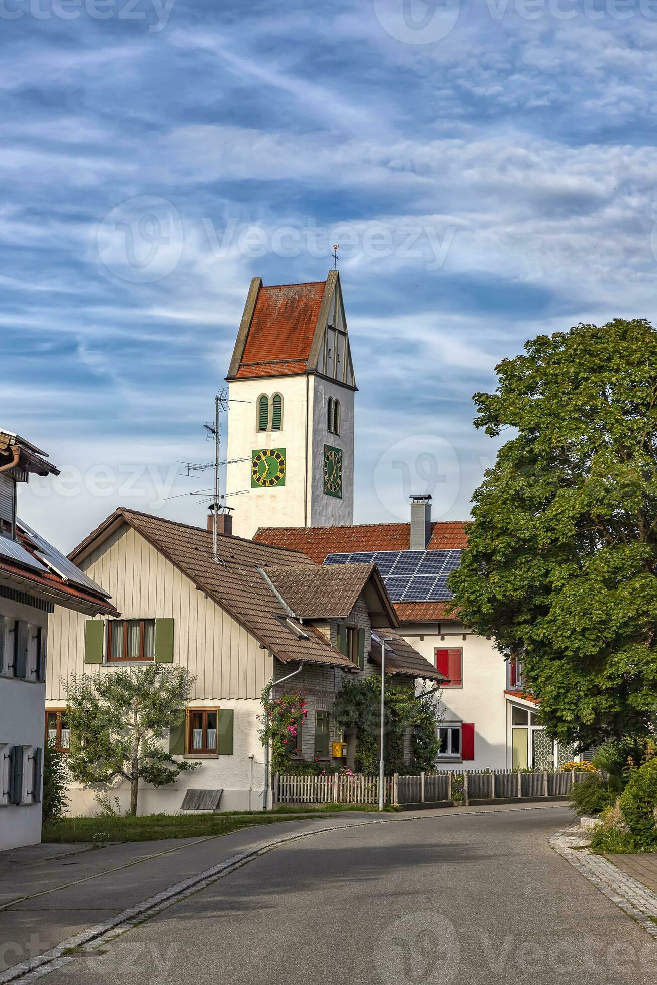 a small quiet street with houses and a clock tower in Leutkirch, Germany 24729111 Stock Photo at