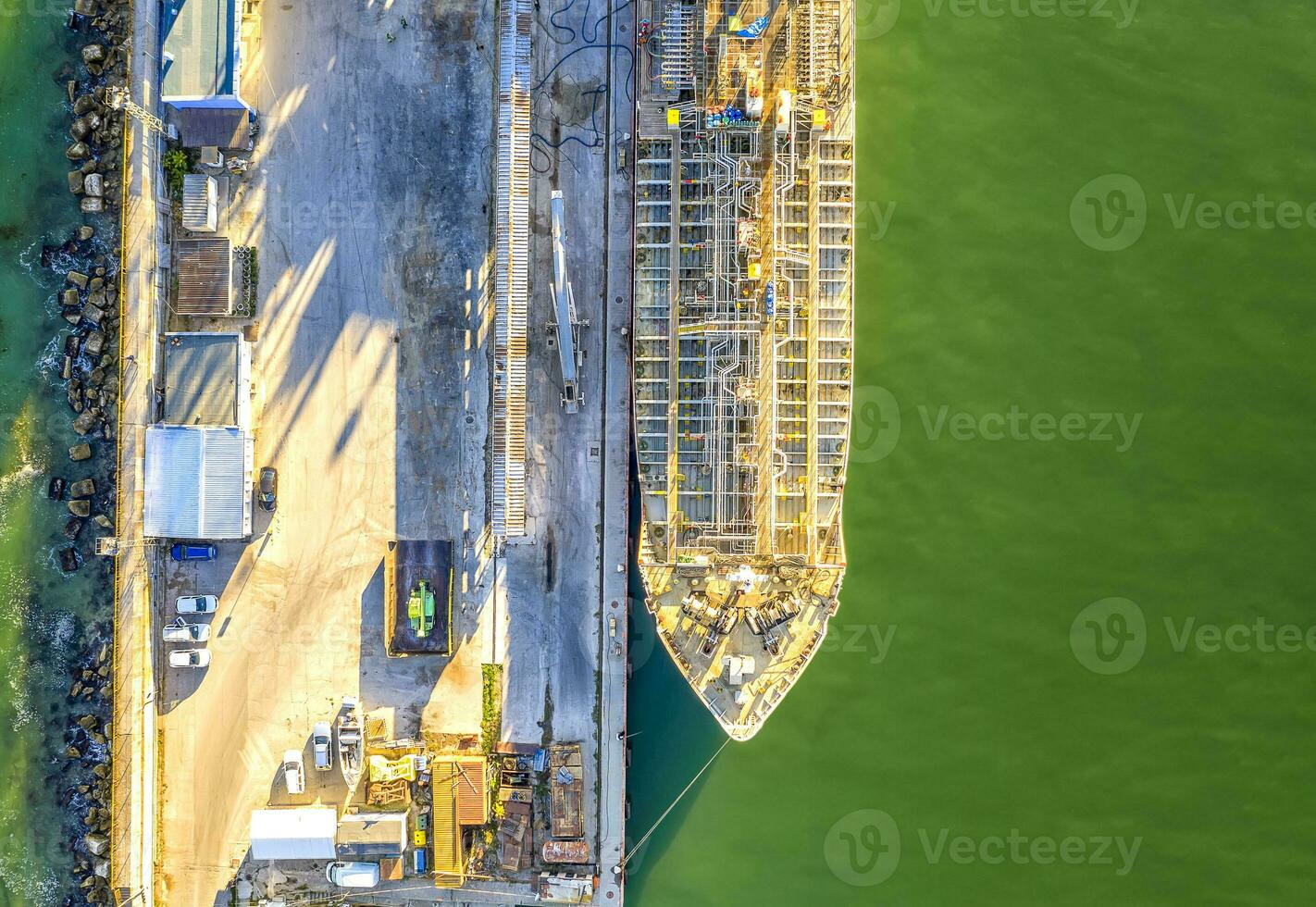 A part of a tanker of the city port. Aerial top view from a drone. Concept export ship photo