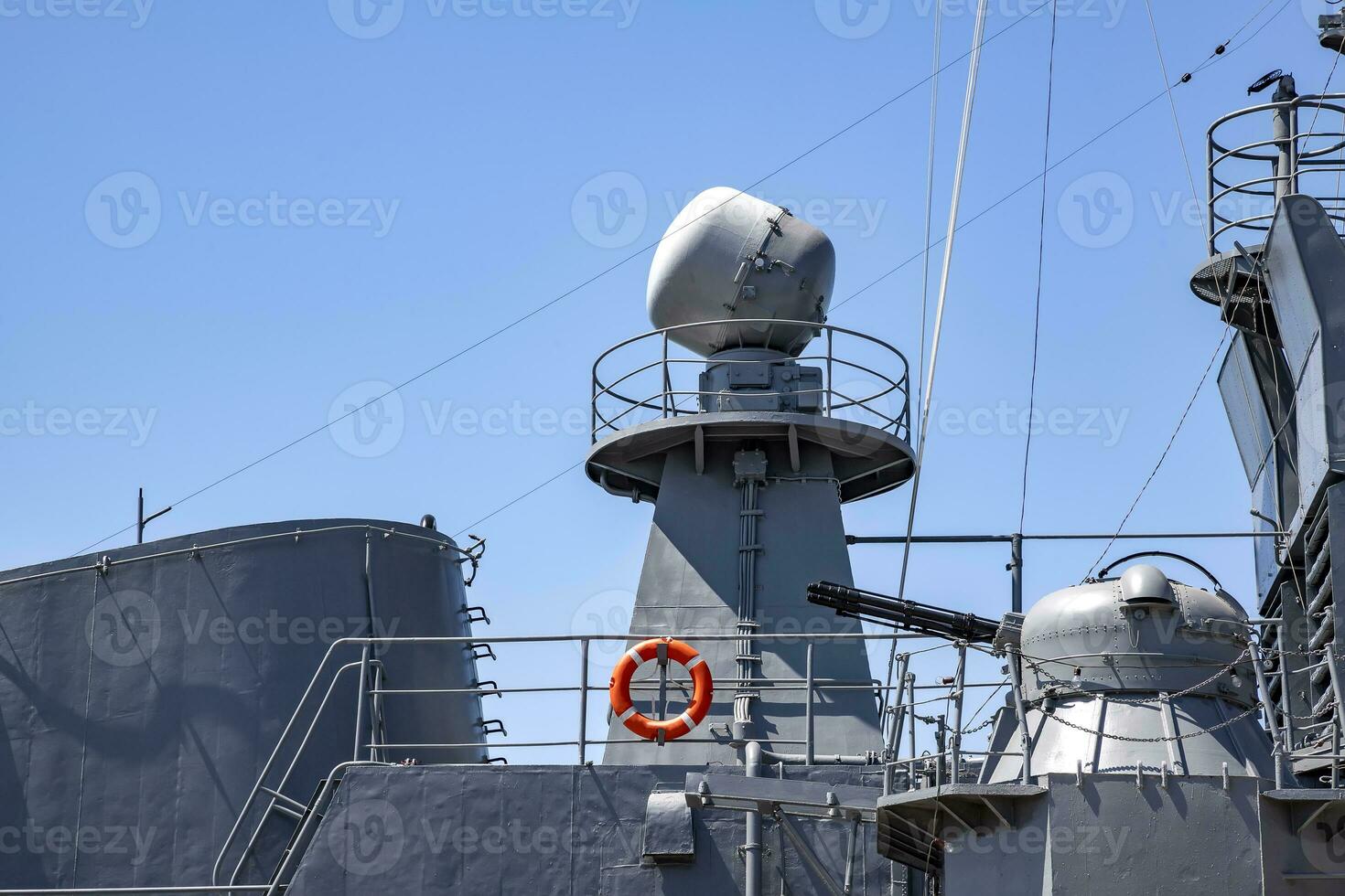 A part of the modern military navy ship. Military sea landscape with clear sky photo