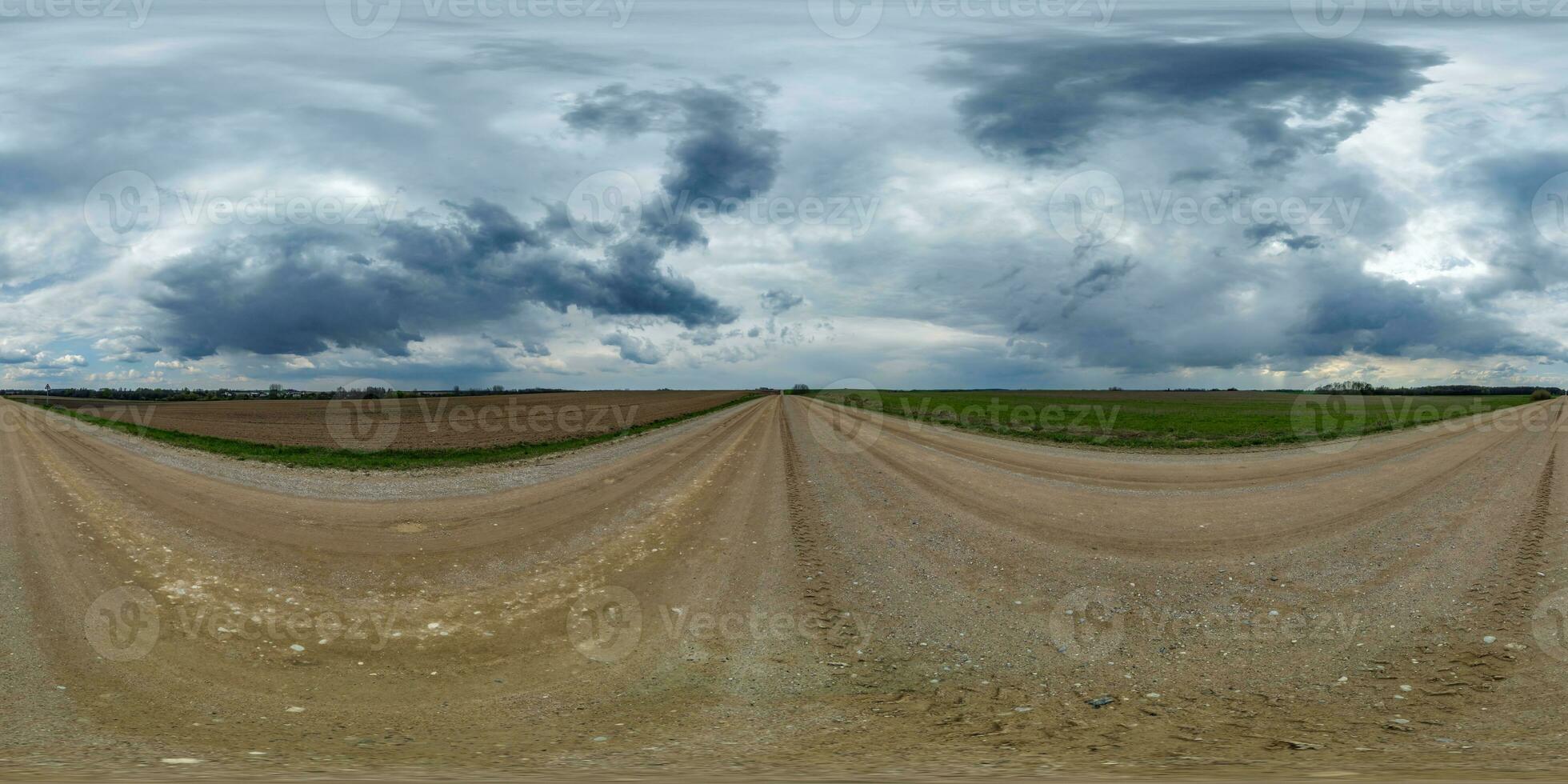 evening 360 hdri panorama on gravel road with clouds on overcast rain sky before storm in equirectangular spherical seamless projection, use as sky replacement in drone panoramas, game development photo