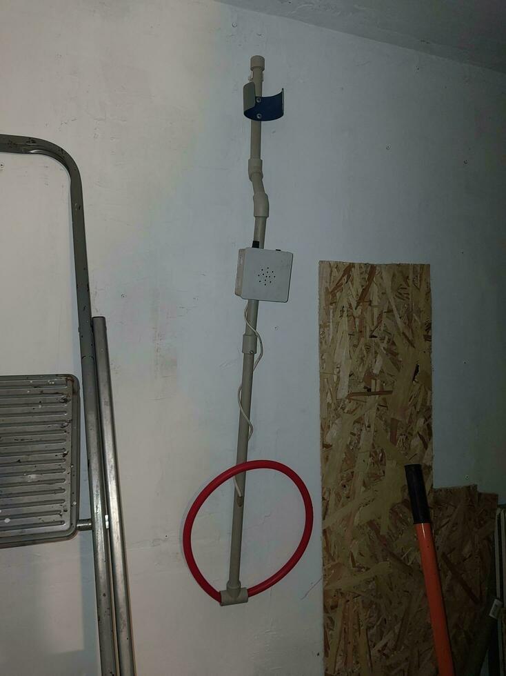 Metal detector hanging on the wall of the house photo