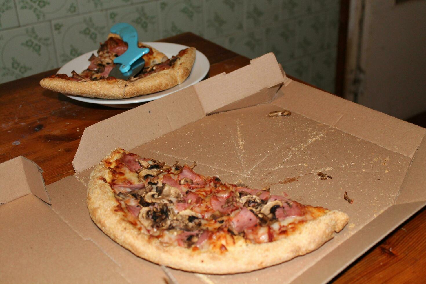 Pizza with bacon, cheese and mushrooms photo