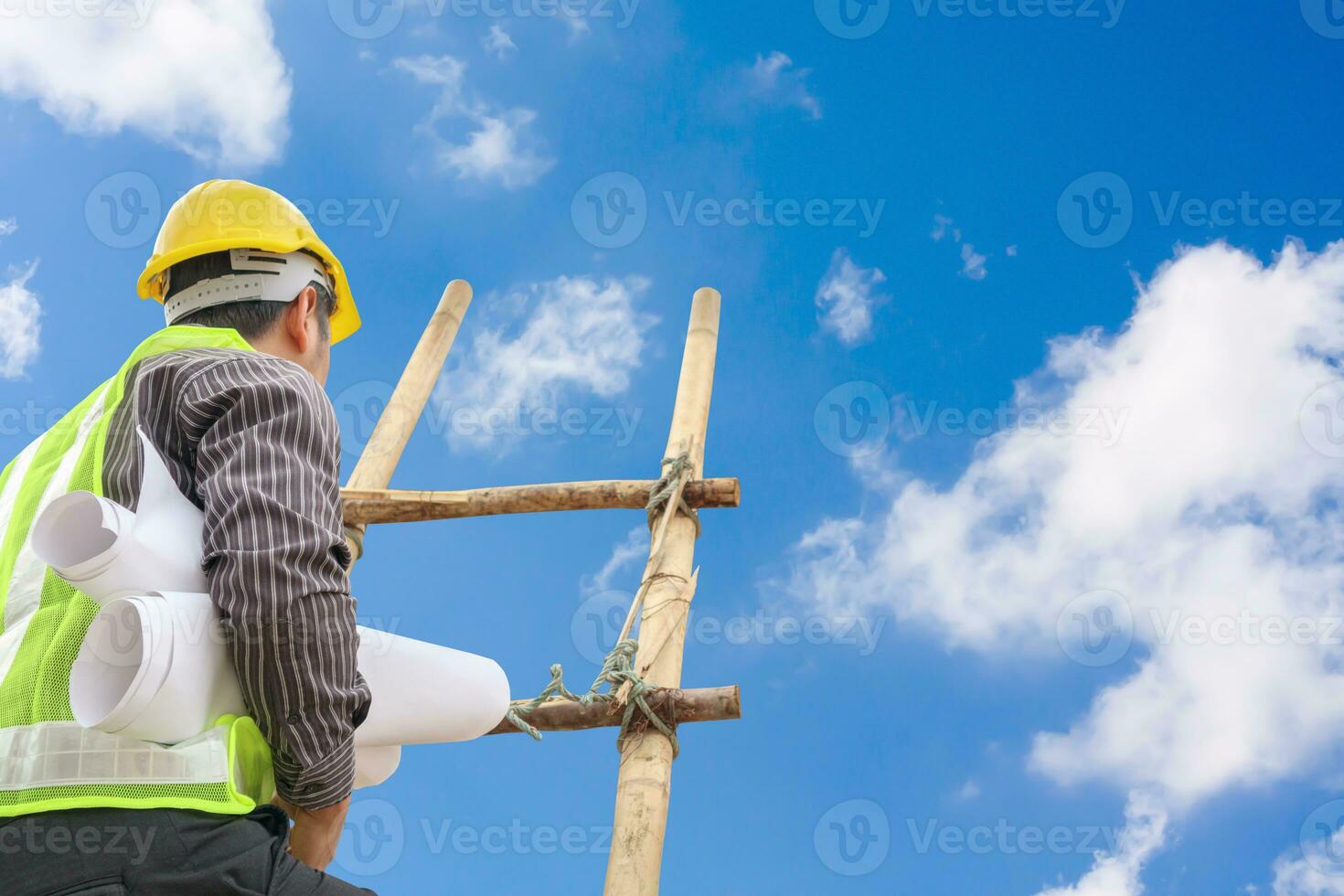 Asian business man engineer climbing up ladder with blue sky, career growth and success concept photo