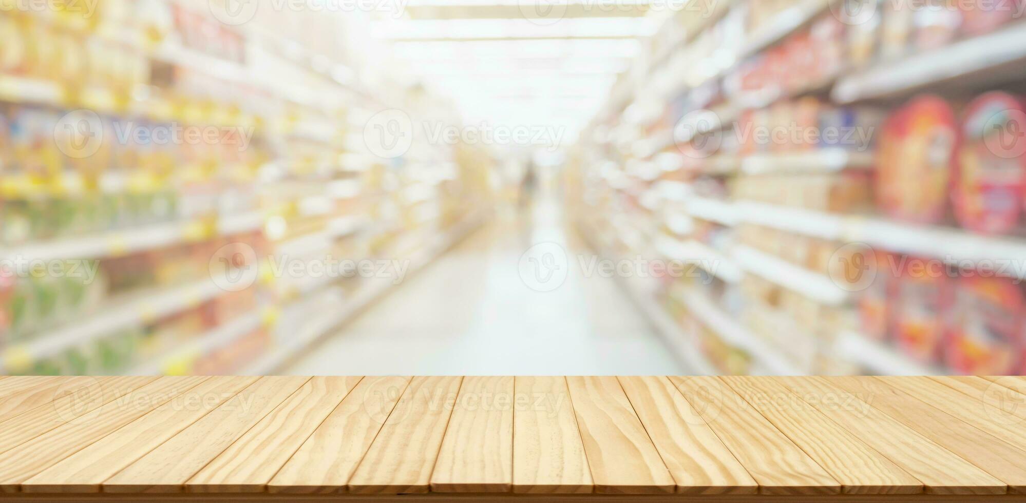 Empty wood table top with supermarket blurred background for product display photo