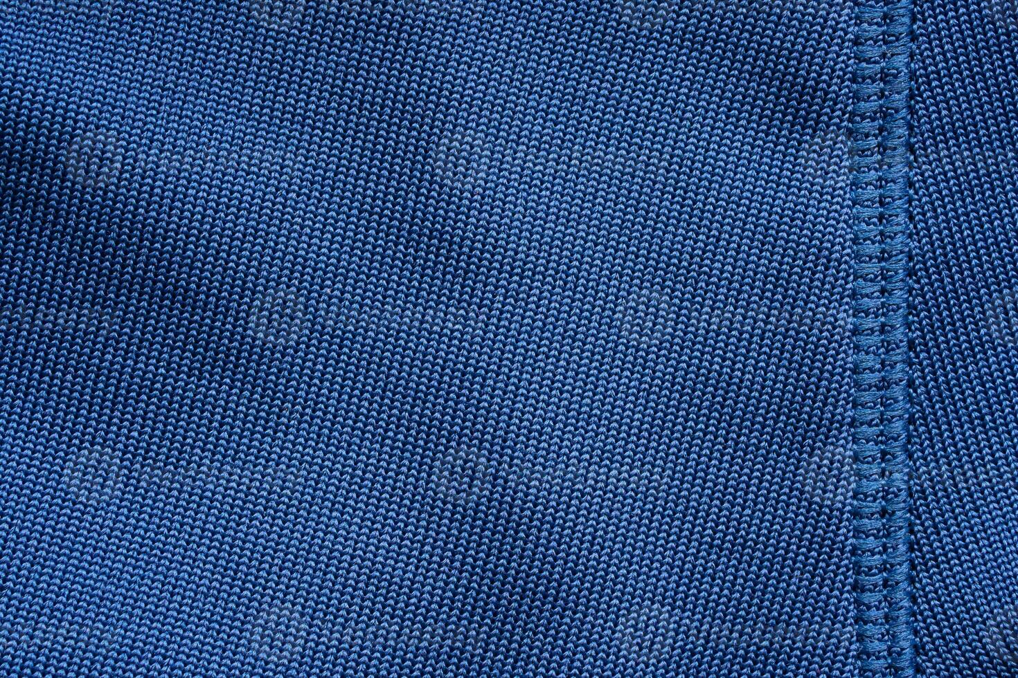 Blue sports clothing fabric football shirt jersey texture with stitches photo