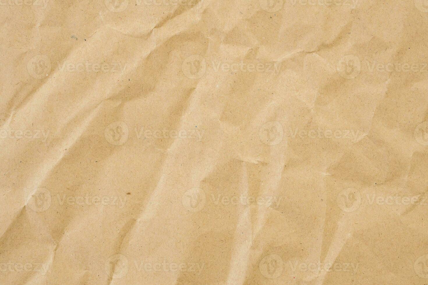 Abstract brown crumpled creased recycle paper texture background photo