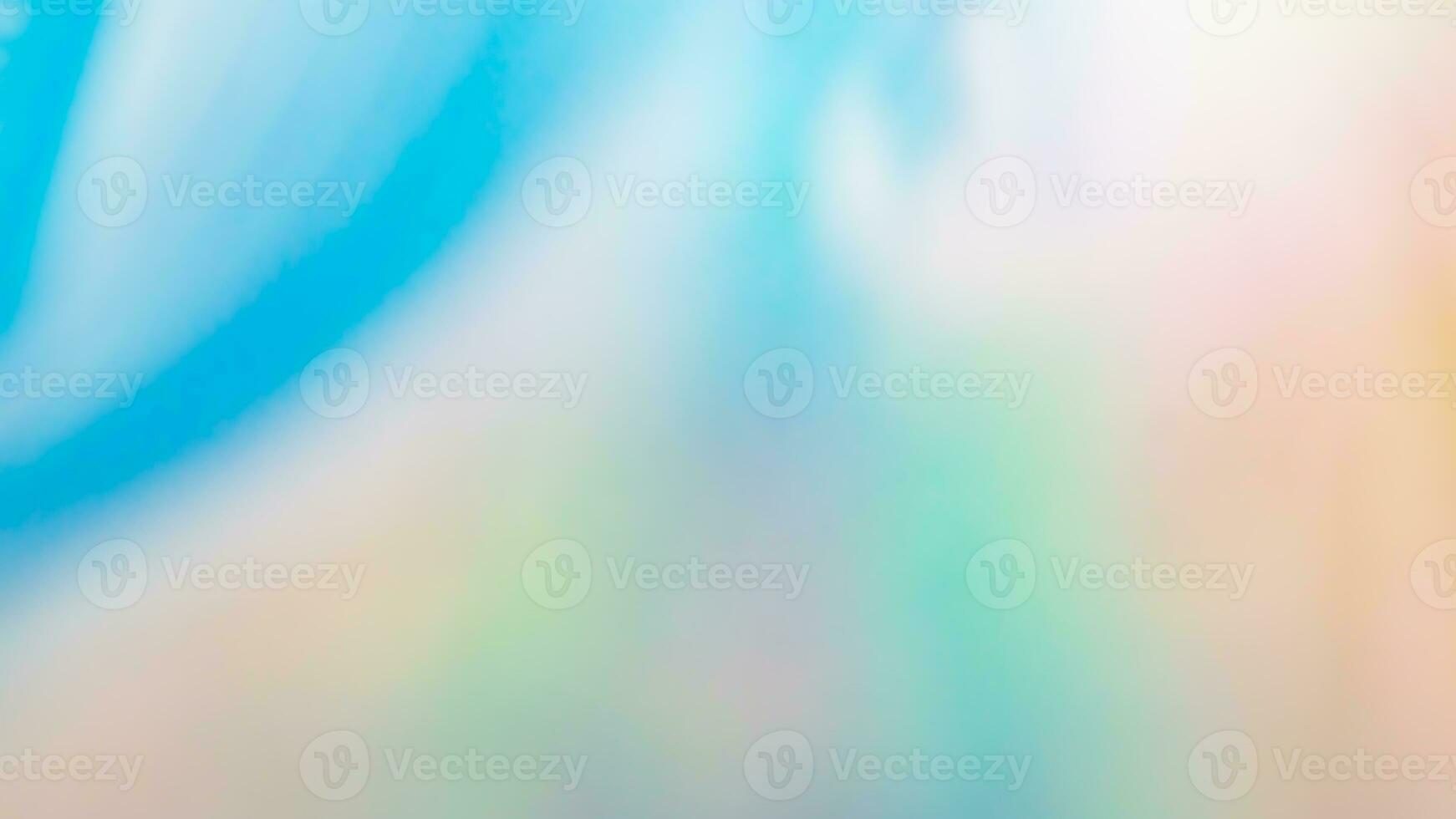 Abstract blur holographic rainbow foil iridescent background photo